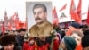 RUSSIA -- Russian Communist party supporters hold portraits of Soviet leader Josef Stalin as they gather to mark the Stalin's 139th birthday on the Red Square, in Moscow, December 21, 2018