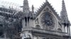 Firefighters work at Notre-Dame Cathedral in Paris