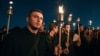 Armenia -- People hold candles during a rally in Yerevan, Armenia