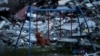 UKRAINE – A teddy bear hangs on a swing next to a damaged building in Saltivka district, amid Russia's attack on Ukraine, in Kharkiv, May 17, 2022